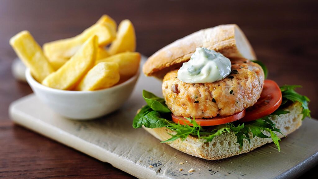 Salmon burgers with basil lime aioli in squid ink brioche